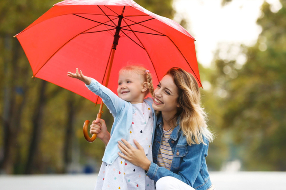 mother and daughter with umbrella